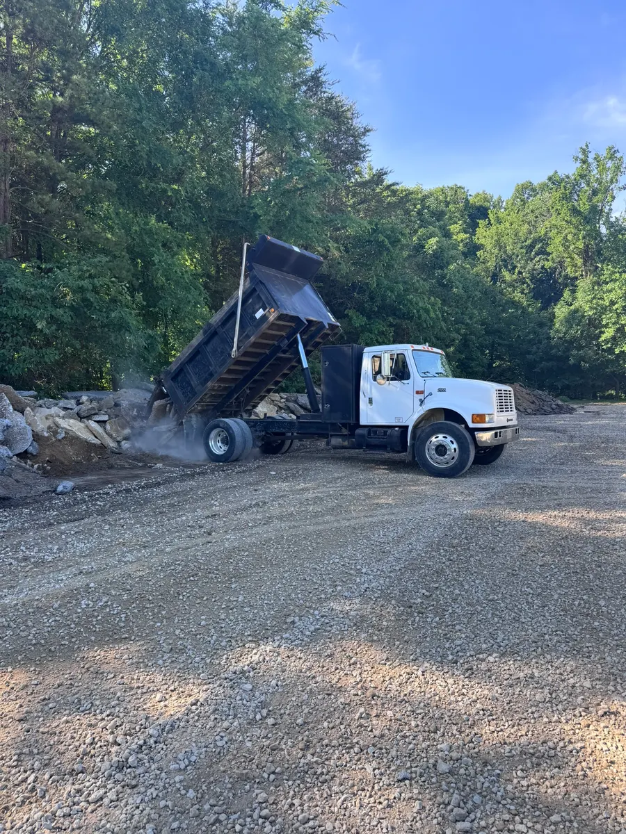 J. Coble dump truck unloading a pickup of clean concrete at the yard